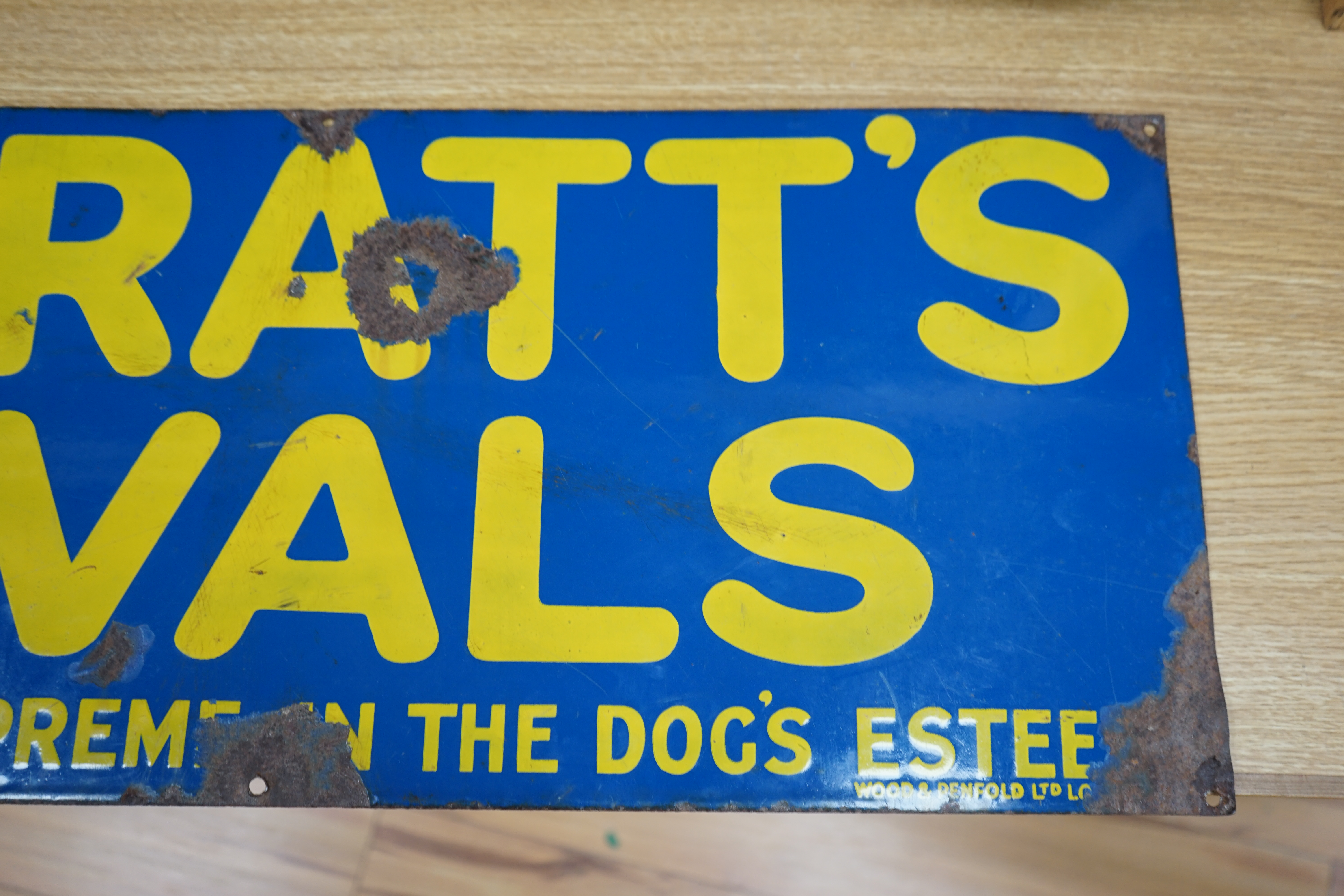 An advertising enamel sign, Spratts Ovals are quite the Supreme in the Dog's Esteem, Wood & Penfold Ltd., 30.5 x 76cm. Condition - poor to fair, several losses as photographed